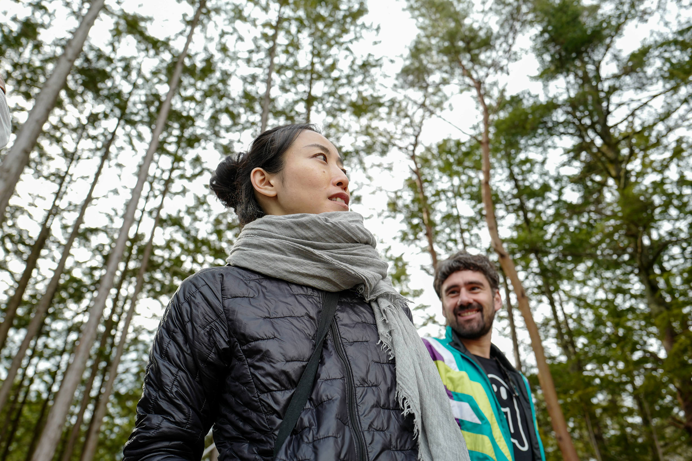 The KinoMa team standing among tall forest trees